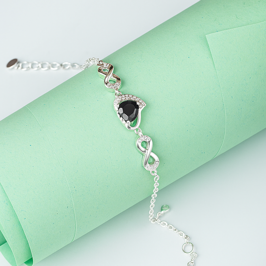 ZWB0132 – Sterling Silver Bracelet with Black Heart Crystal & Pavé Infinity Symbol Accents