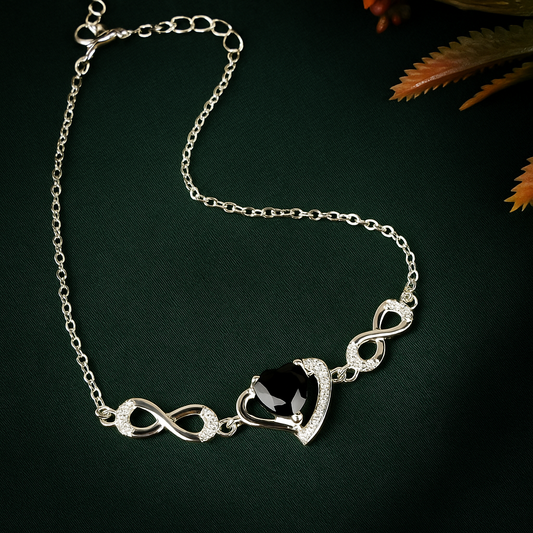 ZWB0132 – Sterling Silver Bracelet with Black Heart Crystal & Pavé Infinity Symbol Accents