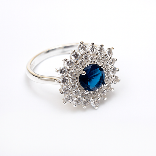 ZWR0154 – Sterling Silver Regal Halo Ring with Deep Blue Sapphire Center